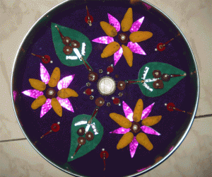 Rangoli with beetle leaves and turmeric