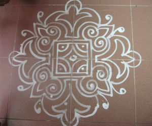 Line kolam with Wet rice maavu (batter)