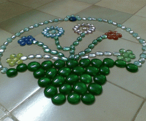 Rangoli: Kolam made with fish tank stones