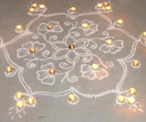 Rangoli: Flowers and Vilakku with candle decoration