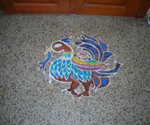 Dotted peacock rangoli