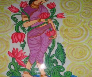 Rangoli: lady painting frame work