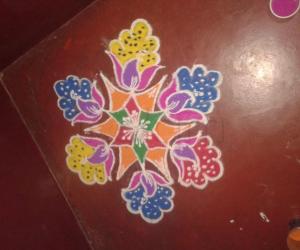 Flower and peacock rangoli