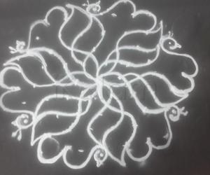 Rangoli: 9 to 5 kolam flower with peacock 