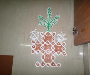 Rangoli: small tulasi brindavan in chikku