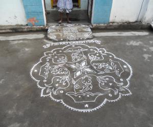 Rangoli: Kolam in white. Christmas.