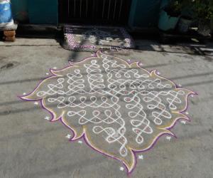 Chikku kolam. Swasthik kolam with leaf like out line.