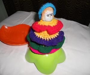 Doll made with crochet frilled skirt & cap.