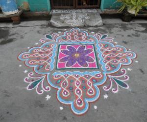 Rangoli: Chikku kolam & flower differently.