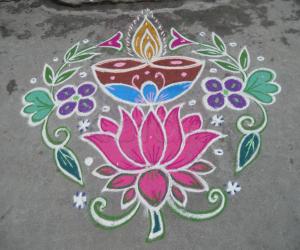 Deepam on lotus kolam.