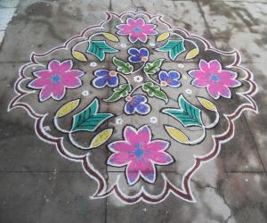 Rangoli: A big flower, embeded with small flowers. Kolam.