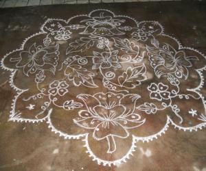 Rangoli: Lotus kolam in white different.