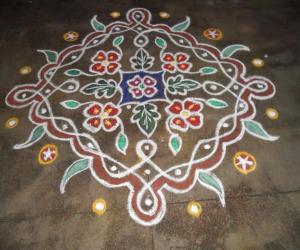 Chikku kolam with flowers & leaves.