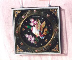 Craft with pins,golden thread & bird and flower decoration.