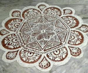 freehand rangoli with rice flour and kavi from my margazhi kolams