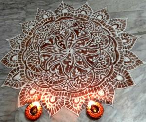 freehand rangoli with rice flour and kavi from my margazhi kolams