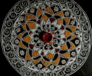 Friday pooja kolam with rice flour coloured with Haldi and Kumkum