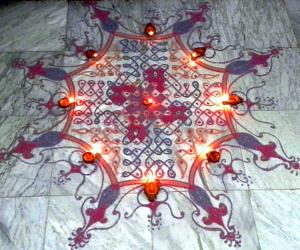 Chikku kolam  with diya (15dots 5lines till 5 straight dots).