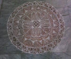 Free hand kolam with rice flour and kavi for margazhi