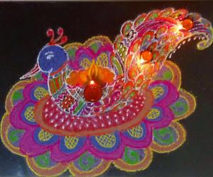 Peacock Rangoli with diyas