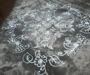 Flower kolam with peacocks