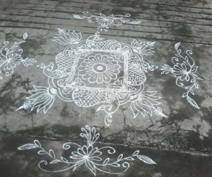 Freehand lotus rangoli with peacocks