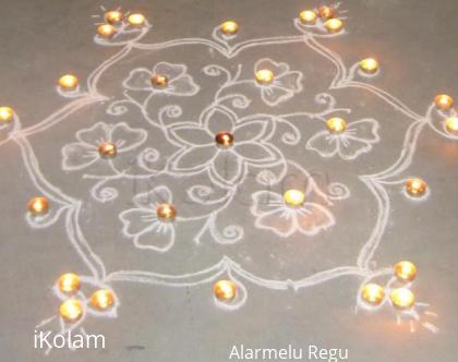 Rangoli: Flowers and Vilakku with candle decoration