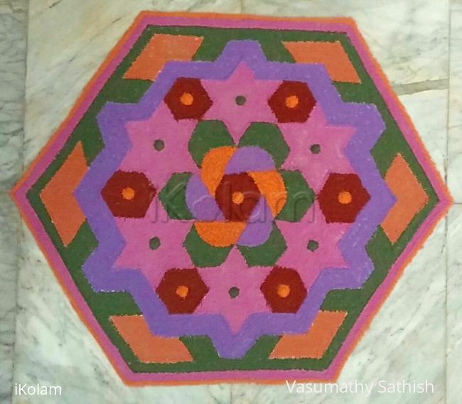 Rangoli: Margazhi Day 23 Kolam - A dotted rangoli with recycled colours. 15-8 interlaced dots. 