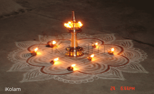 Rangoli: Traditional design with lamps