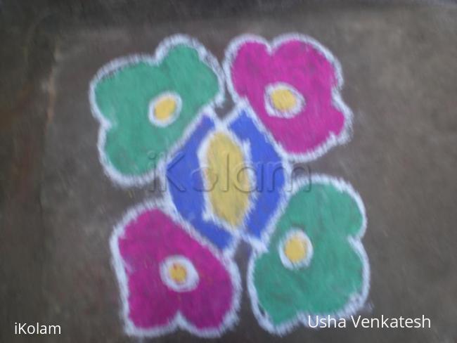 Rangoli: dotted kolam cloured  6 dots 6 lines.