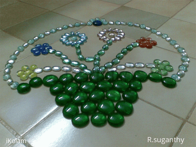 Rangoli: Kolam made with fish tank stones