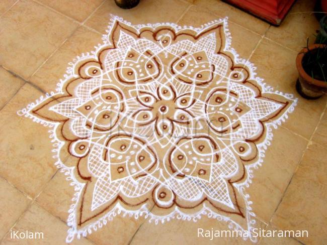 Rangoli: Dotted kolam in white with  Red kaavi