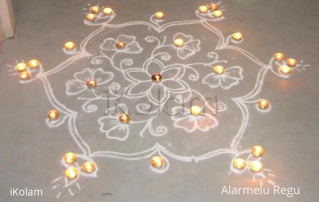 Rangoli: Flowers and Vilakku with candle decoration