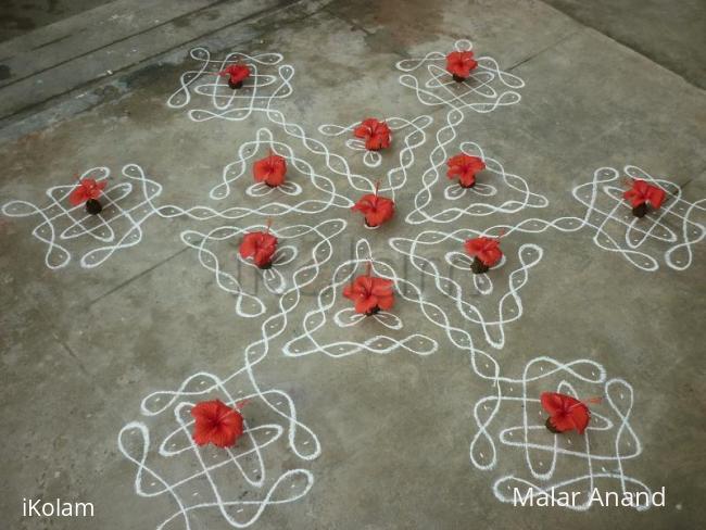 Rangoli: Dotted kolam with hibiscus flower