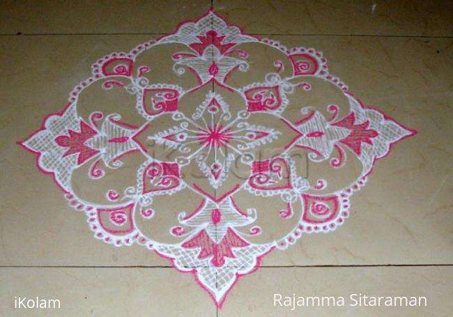 Rangoli: Pink and white design kolam