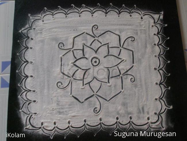 Rangoli: black kolam on white base