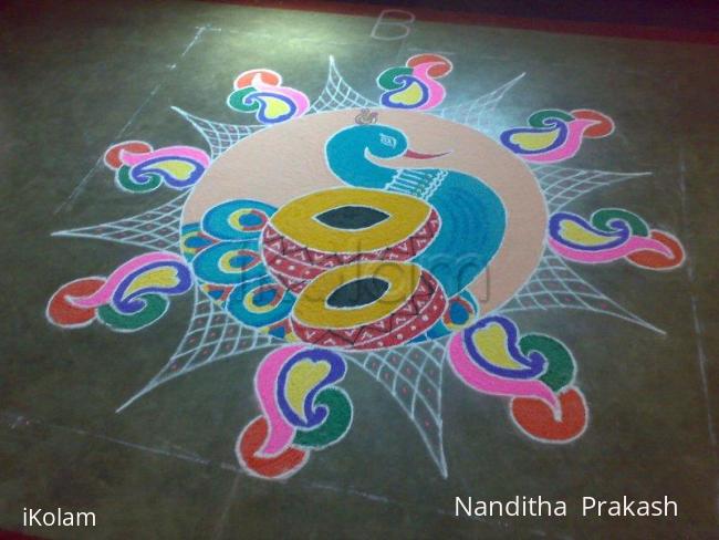 Rangoli: peacock with drum