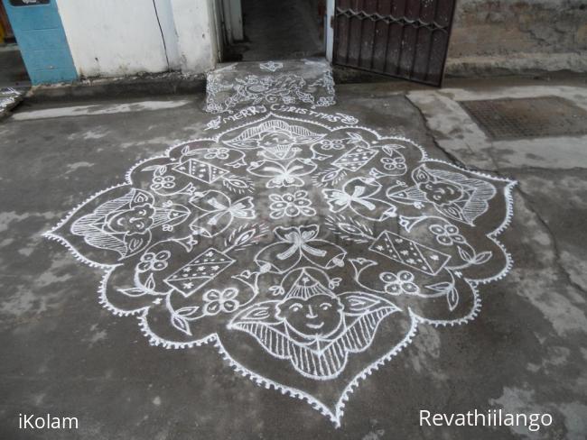 Rangoli: Kolam in white. Joker, candle & bell for christmas.