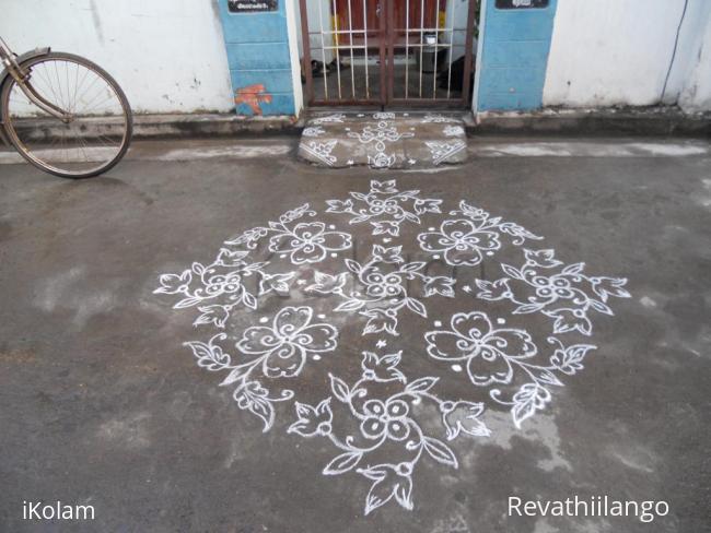 Rangoli: Pookolam in white.