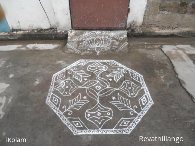 Rangoli: A simple kolam in white.