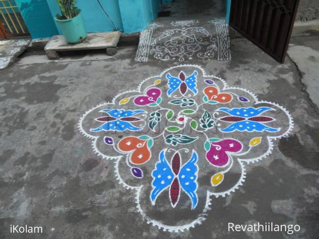 Rangoli: Butterfly, flower & leaf kolam.