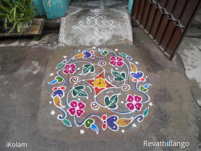 Rangoli: Creeper with colour colour flowers.