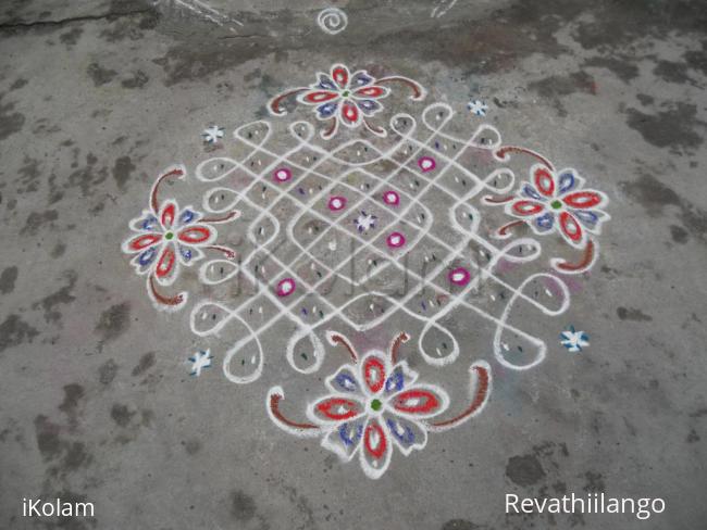 Rangoli: A simple Chikku Kolam with flowers.