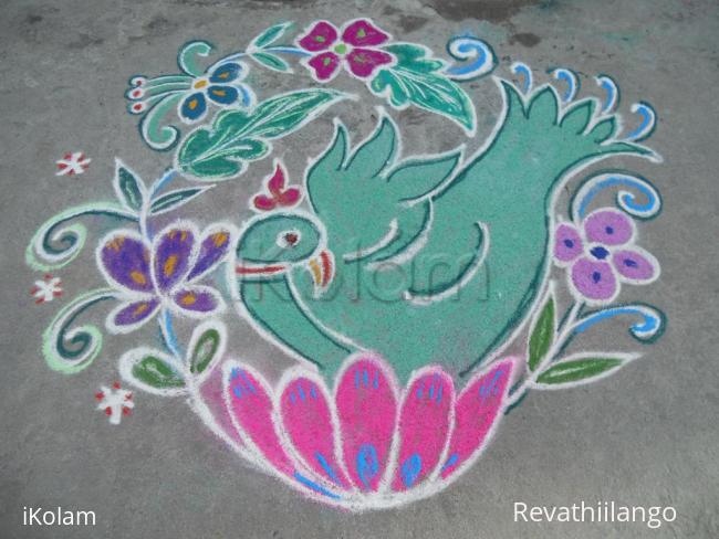 Rangoli: Green bird on flower.