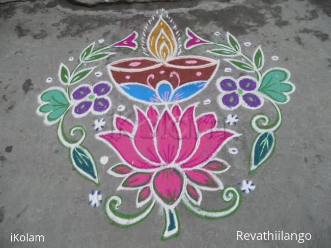 Rangoli: Deepam on lotus kolam.