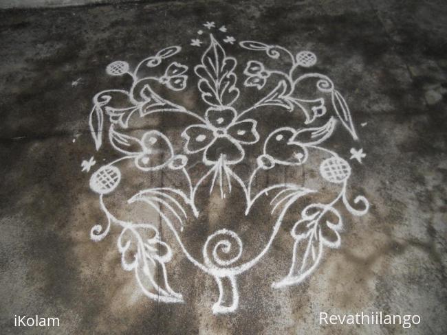 Rangoli: Kolam in white flower bunch.