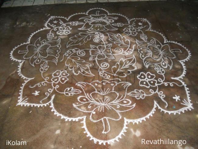 Rangoli: Lotus kolam in white different.