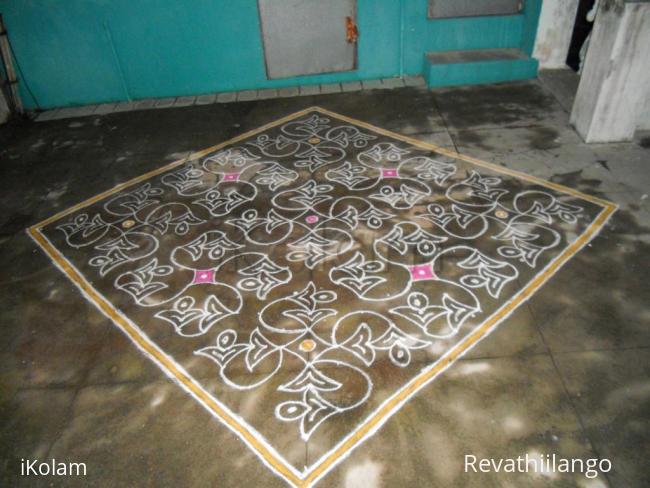 Rangoli: A different swasthik kolam as padi kolam.