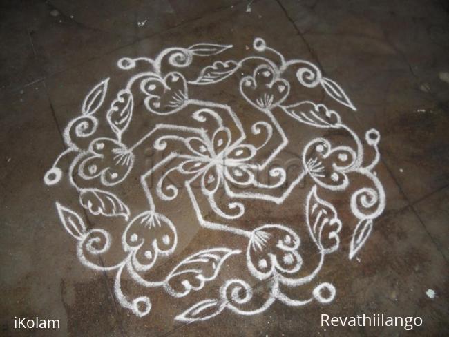 Rangoli: Daily kolam in white.