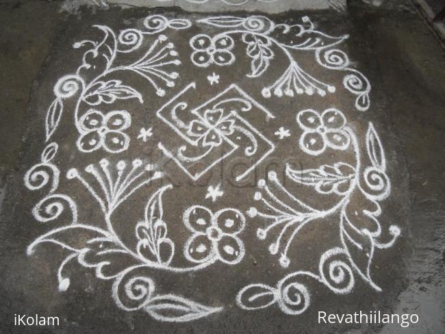 Rangoli: Swasthik & flowers kolam.